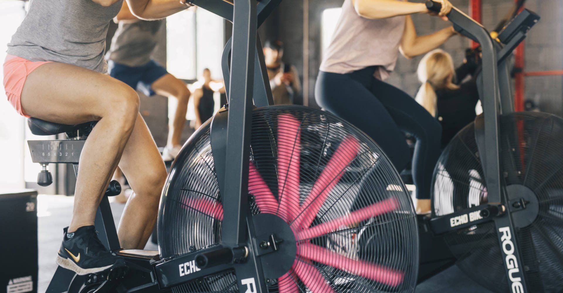 Women riding bicycle on sports performance training