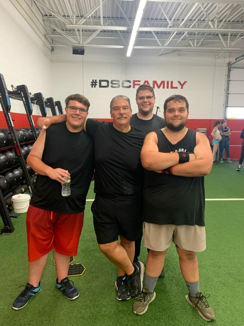 Four guys posing after a training